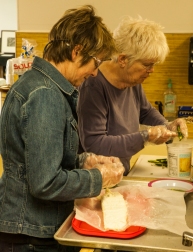 Kate Painter and Kathy Sheffler prepare hors d'oeuvres.